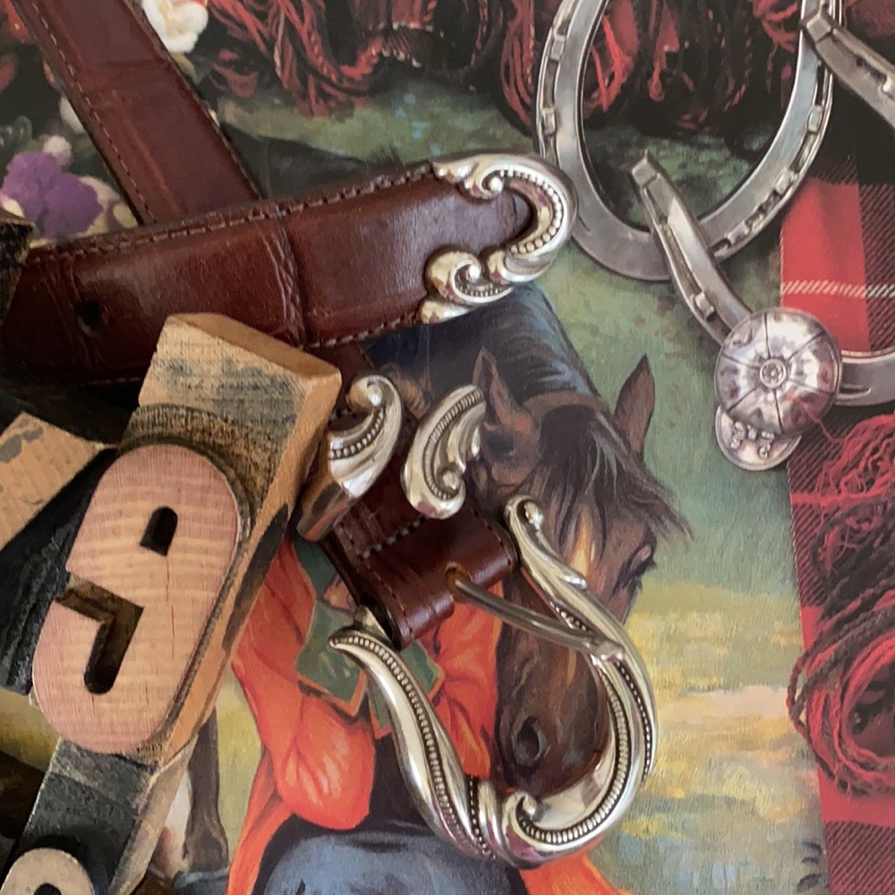 Woman’s Leather Belt Embellished with Decorative Silver Hardware